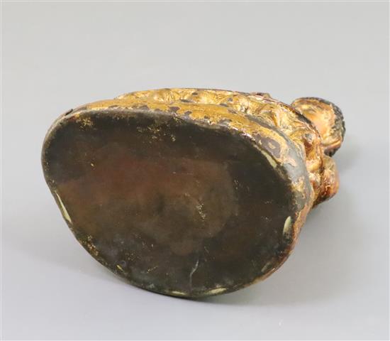 A Chinese gilt lacquered bronze figure of Buddha, 18th/19th century, H. 7.3cm, repair to neck